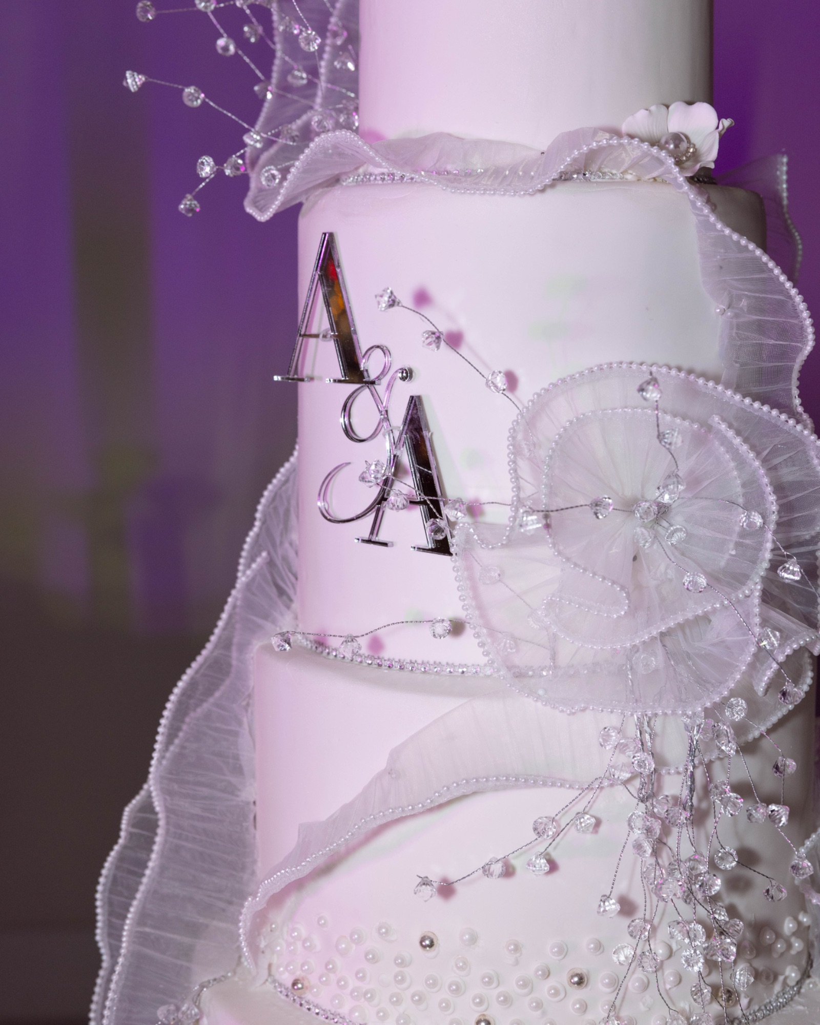 The tiered cake lit in the reception