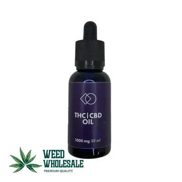 A 30ml bottle of balanced 1:1 THC and CBD oil with a golden cannabis extract and glass dropper.