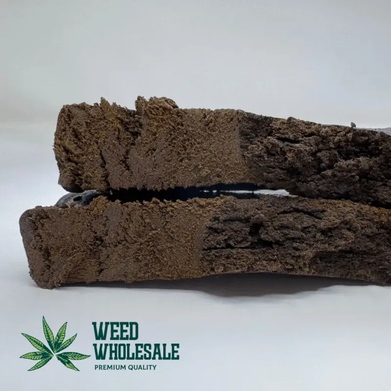 Maza-i-Sharif Afghan Hash showing a dark, chocolate-brown exterior and a dense, malleable texture.