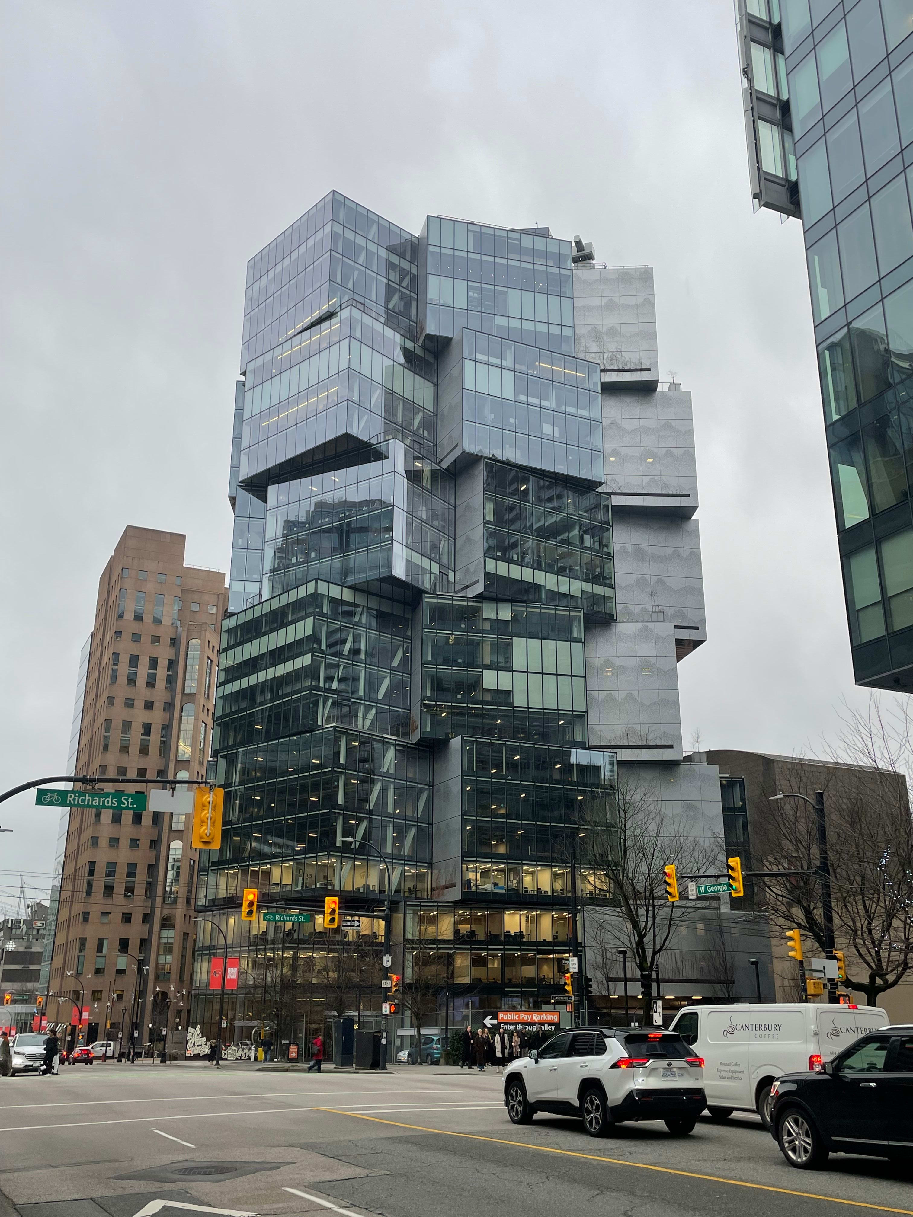 A strangely shaped office building on the streets of Vancouver.