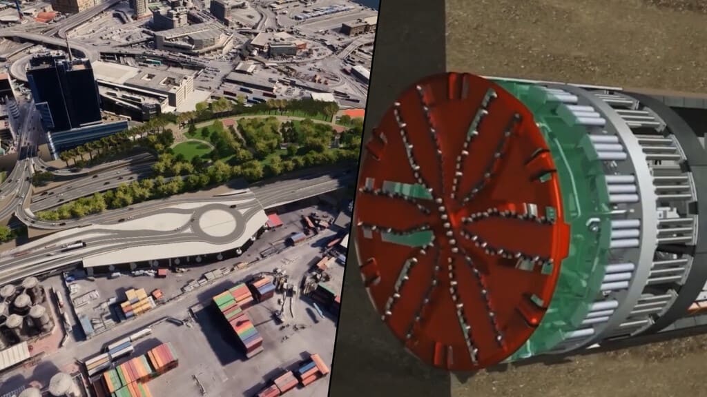 Vista aérea de una gigantesca tuneladora excavando bajo el mar en Génova, Italia, con la ciudad al fondo.