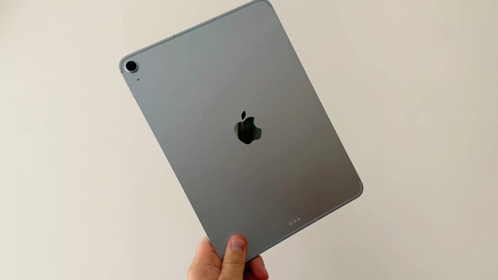 A selection of iPads laid out on a clean, modern desk, showcasing different models and sizes.