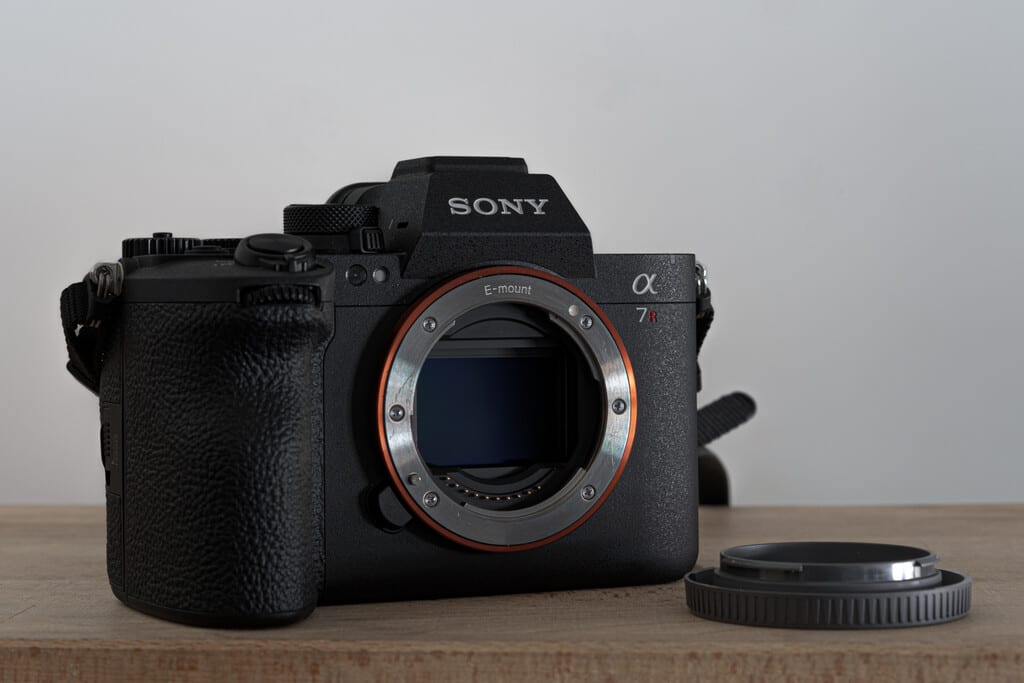 Sony A7R VI camera body with lens attached, studio lighting