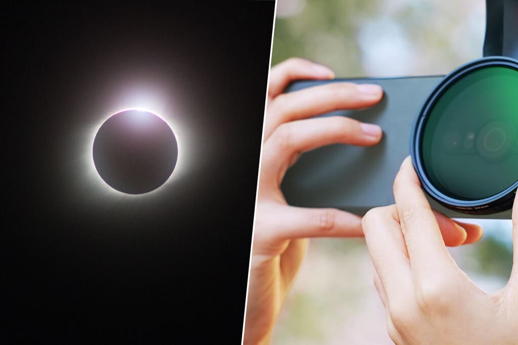 Un smartphone apuntando a un cielo con un eclipse solar, con un filtro ND acoplado a la lente.