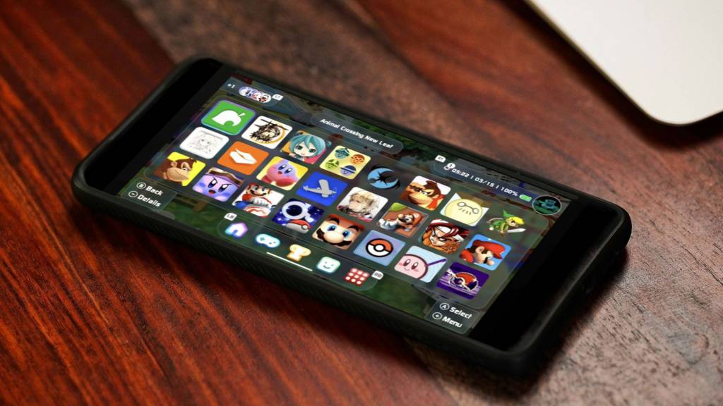 Un smartphone Android antiguo mostrando una interfaz de consola de videojuegos retro con carátulas de juegos clásicos.
