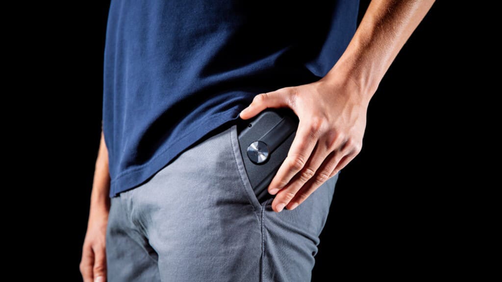 Razer Prio controller folded in hand, emphasizing its compact size.