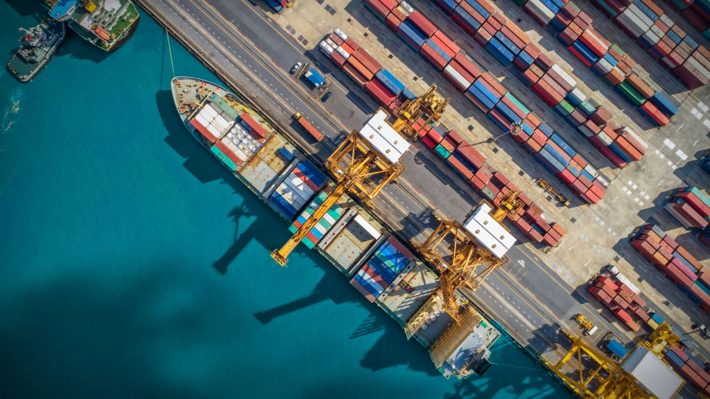 An aerial view of a docked ship in a port