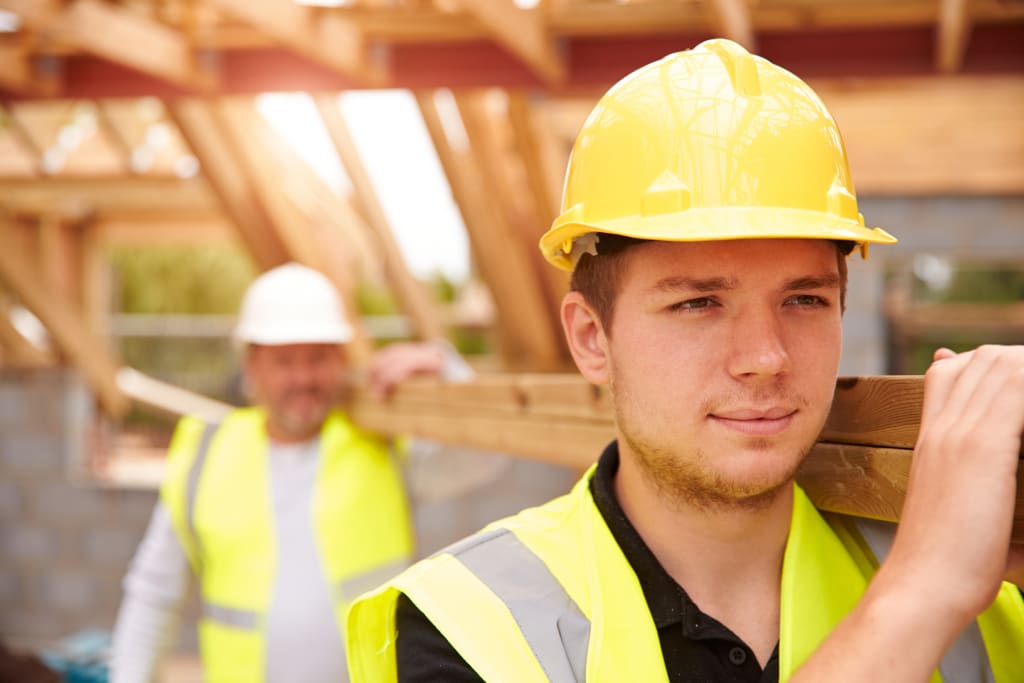 A worker in a high vis hardhat