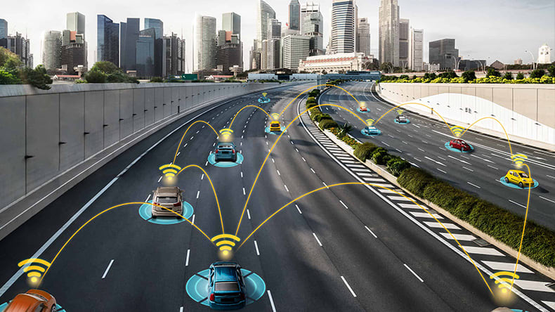 A highway populated with cars equipped with wireless communication technology, depicted by yellow arcs connecting them, showcasing a city skyline in the background.