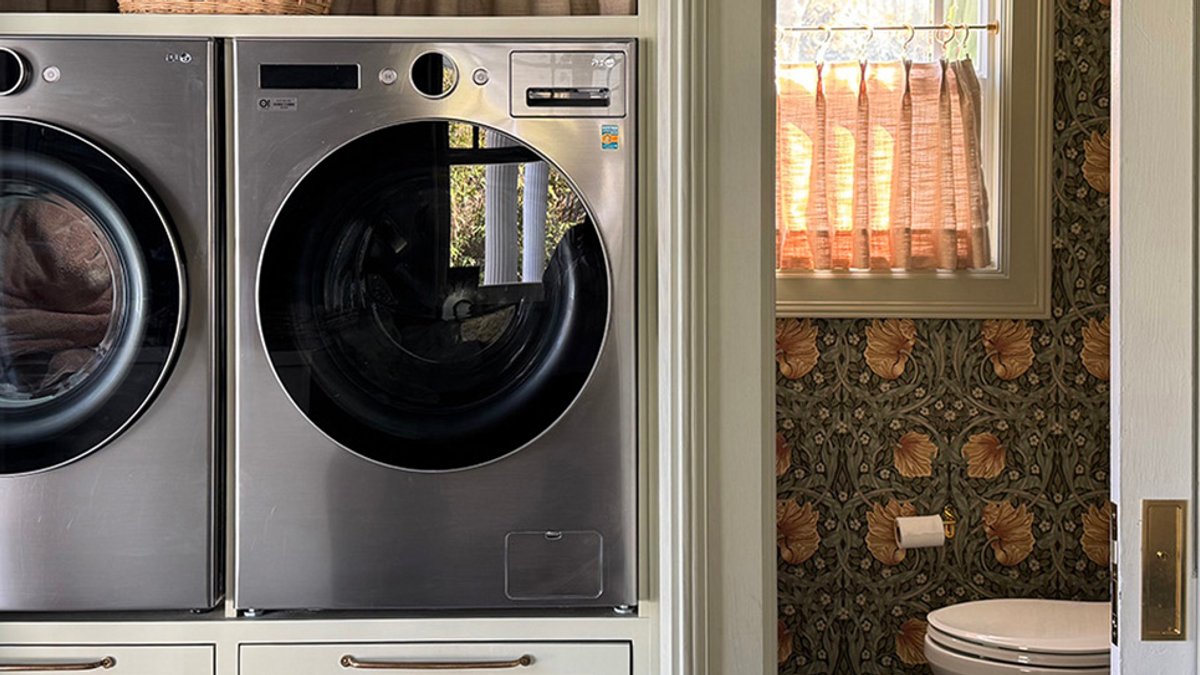 Hidden Laundry Room Keeps Clutter Out Sight - laundry room