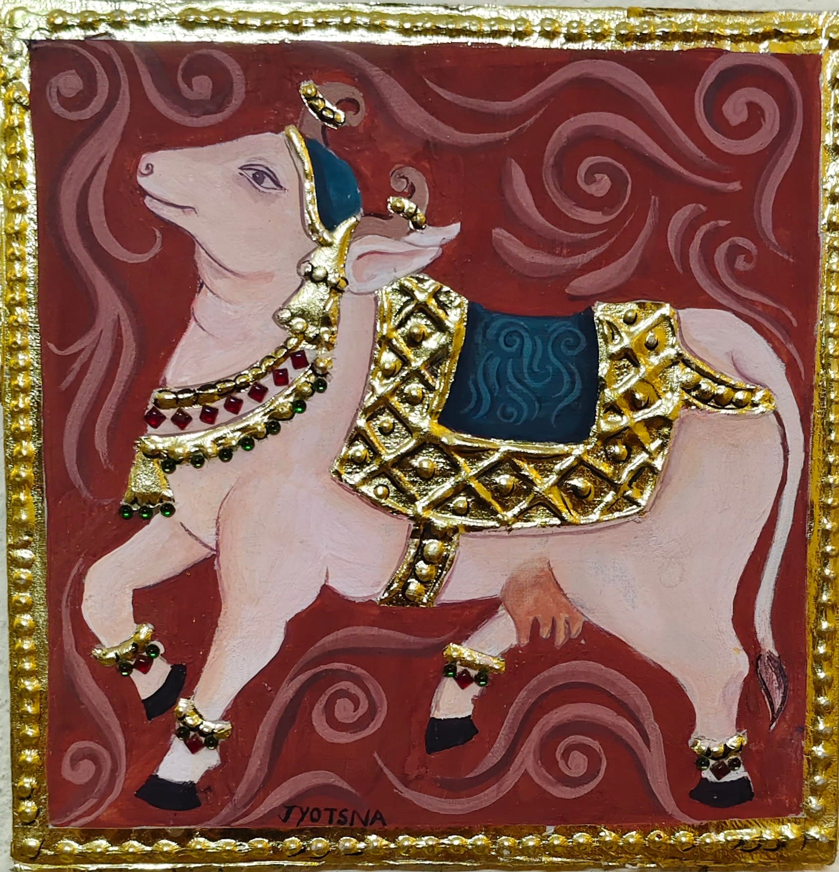A painting of a white Nandi bull with gold foil saddle and jewelry, set against a dark red background with swirls.