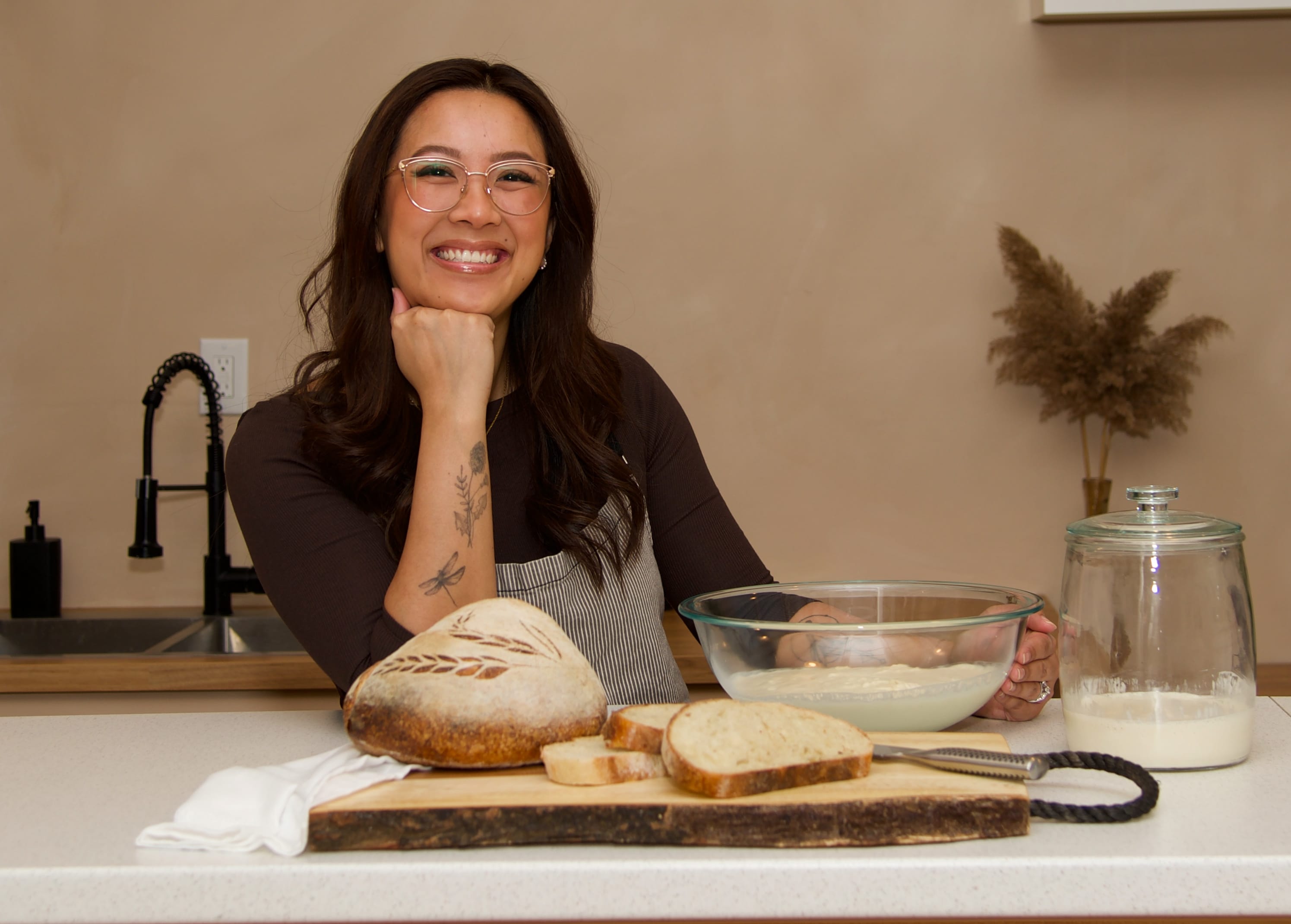 Jennie smiling with bread