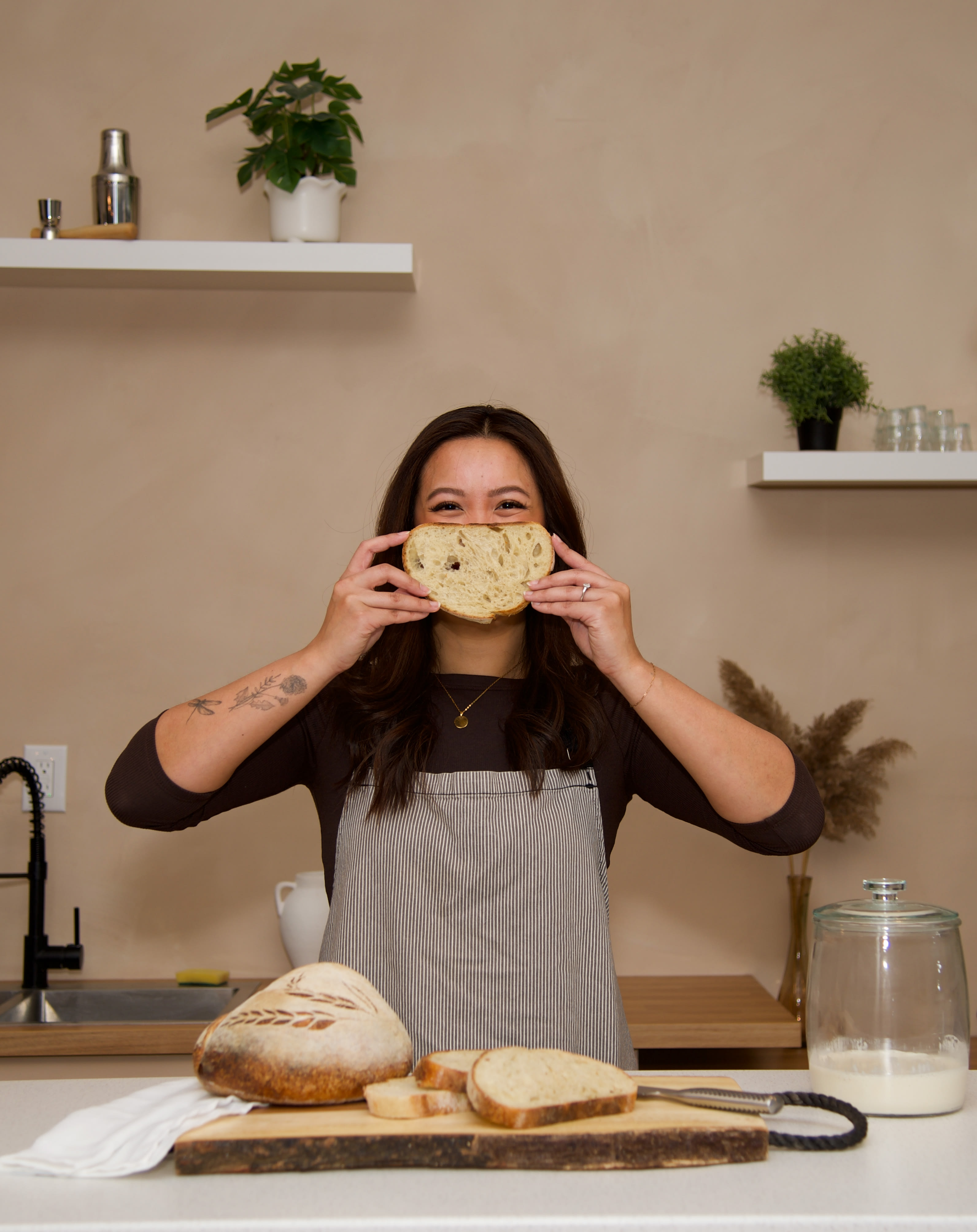 Jennie smiling with sourdough