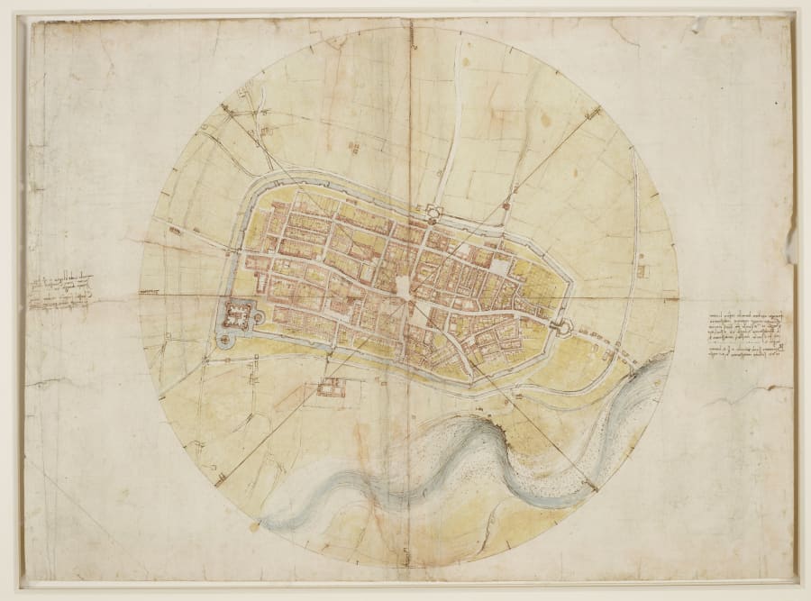 A Renaissance map of a walled town seen from directly above, drawn in ink with pink and yellow washes inside a large circle crossed by radiating lines, with a blue river winding across the bottom.