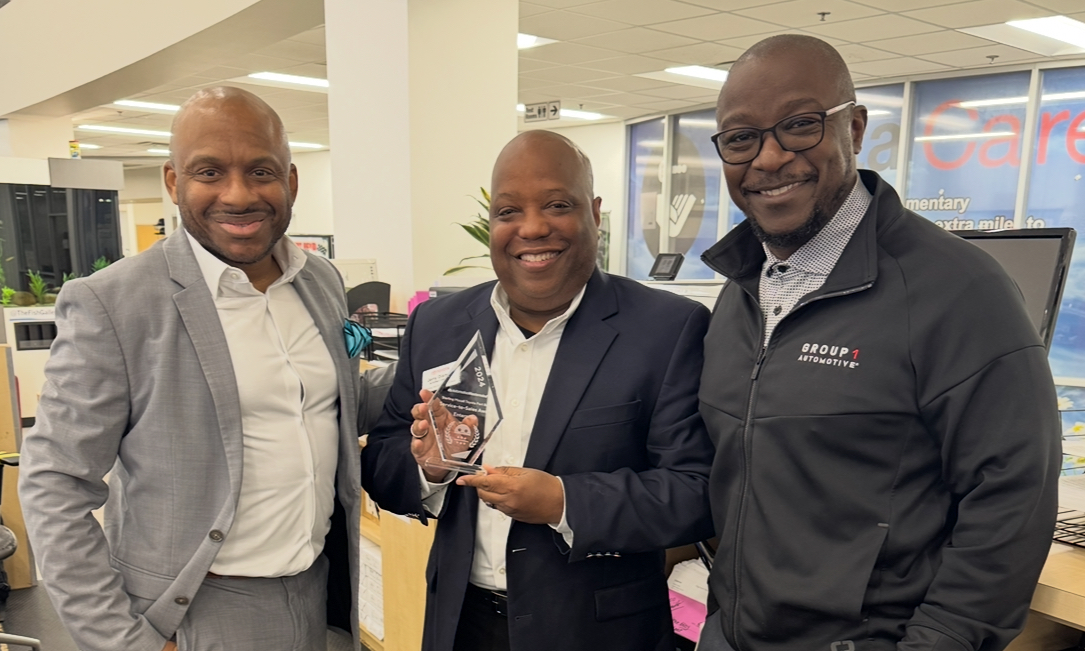 Pictured: Sam Scott, celebrating the Sterling McCall Toyota Fort Bend team after their recent Sales Excellence award win