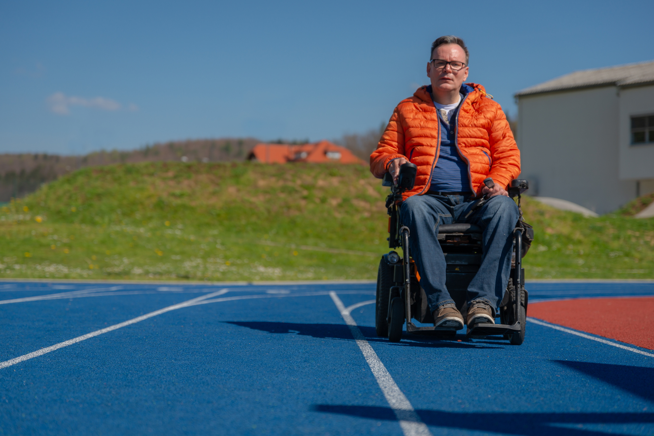 A disabled man in a motorized wheelchair