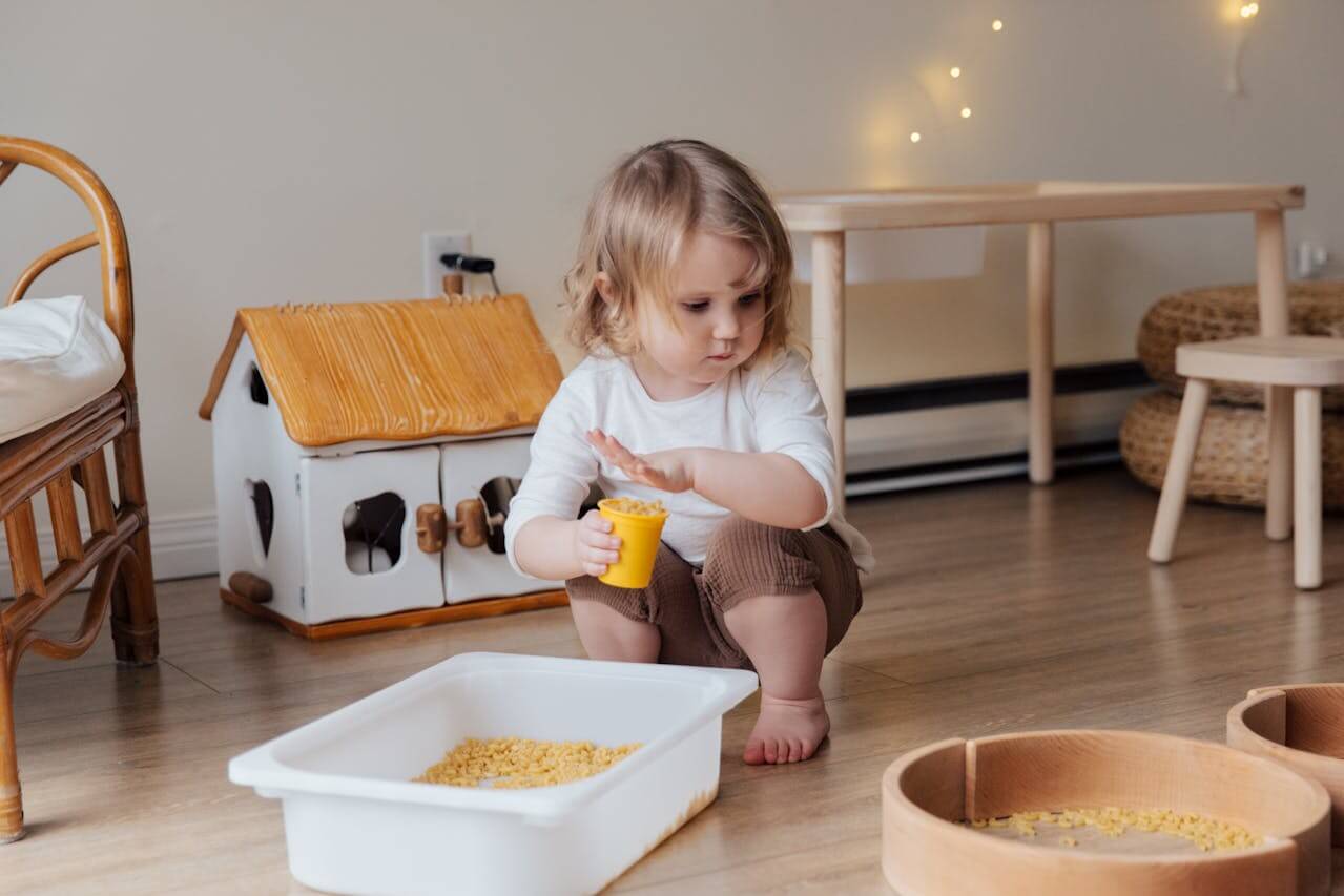 Sensory play setup with colorful bins and textures for toddlers