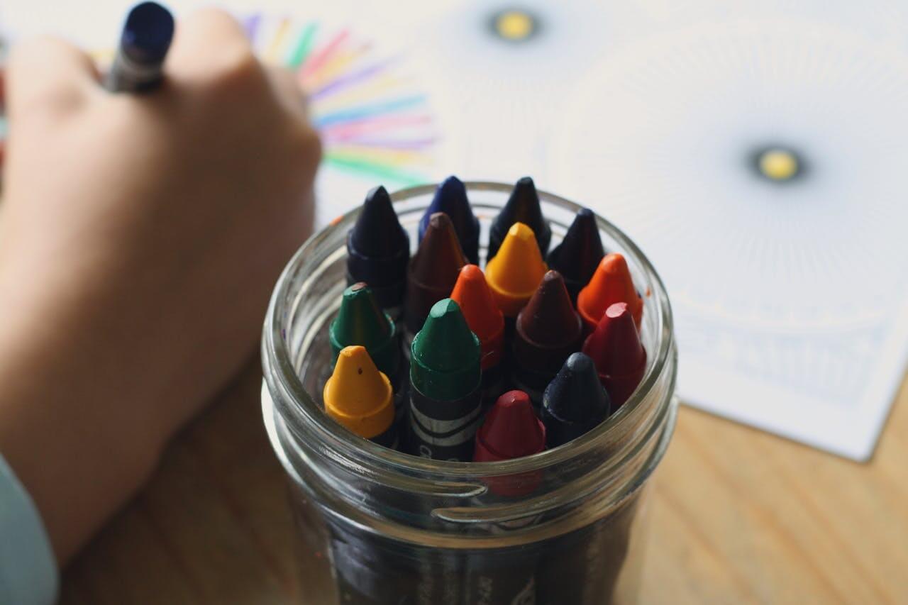 Kids drawing and expressing creativity at an art table