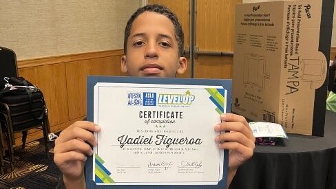 Orlando student Yadiel with certificate