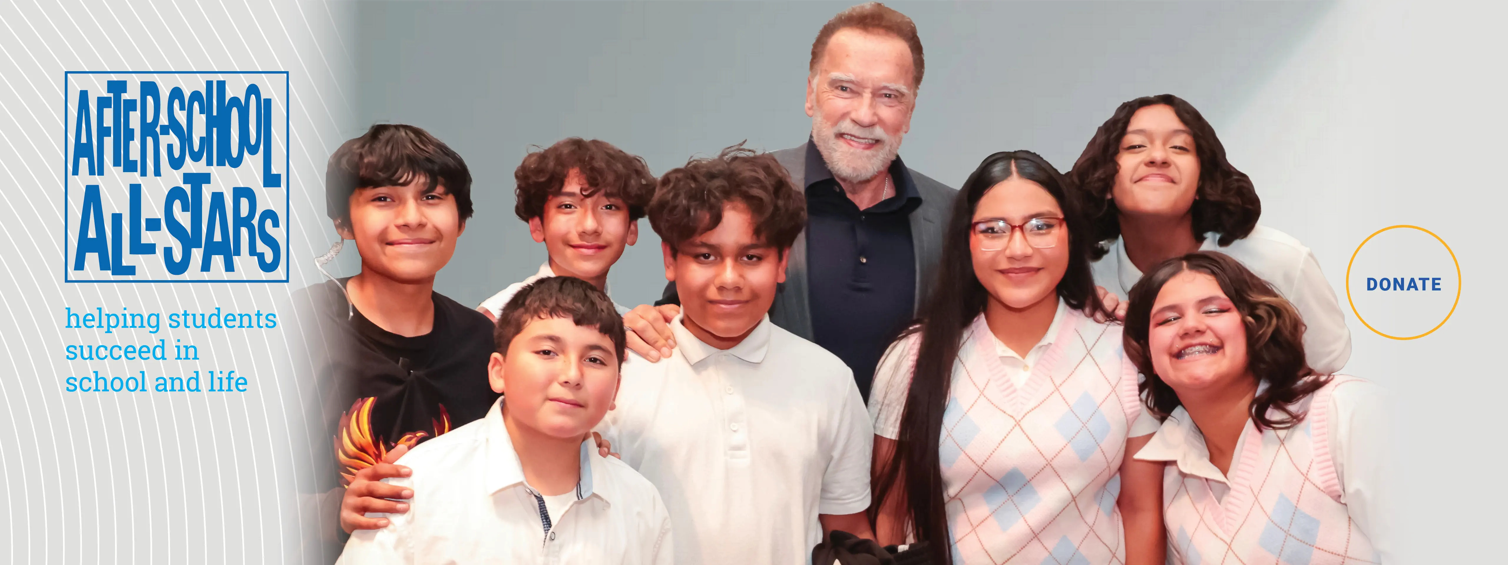 Arnold Schwarzenegger standing with students