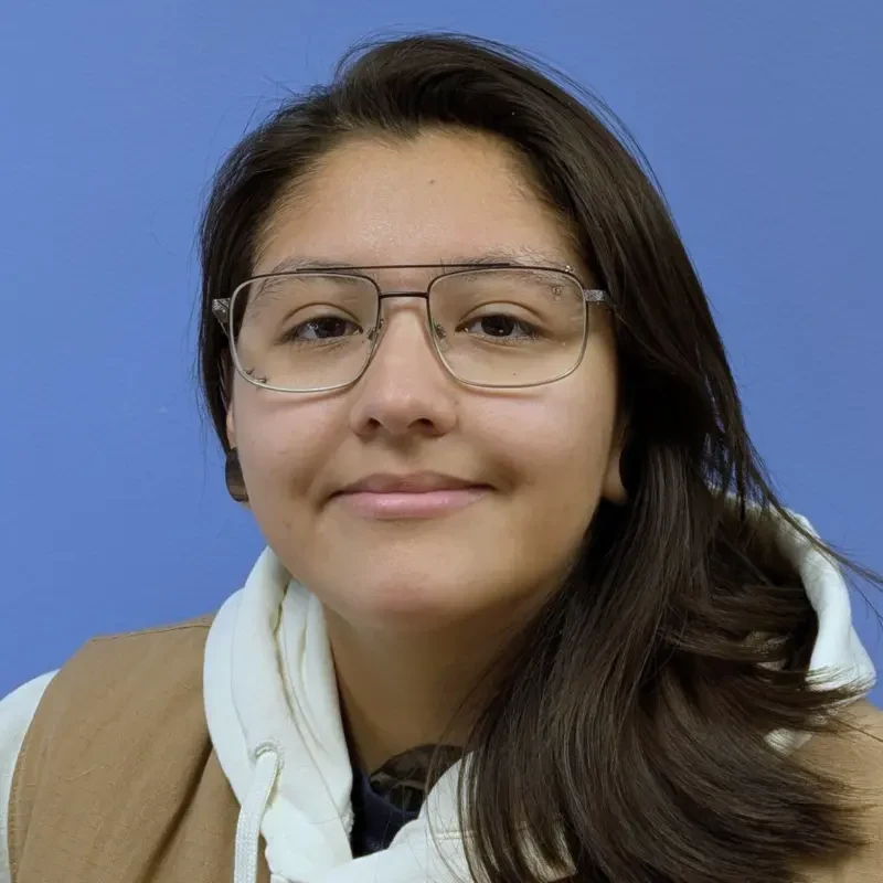 Woman wearing glasses and a hoodie
