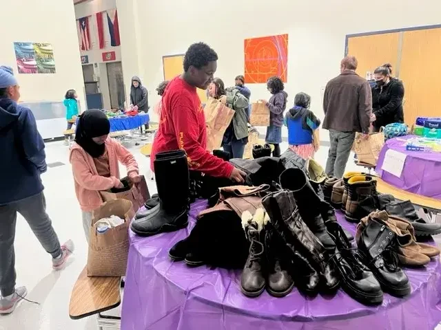 Students at a free used clothing event