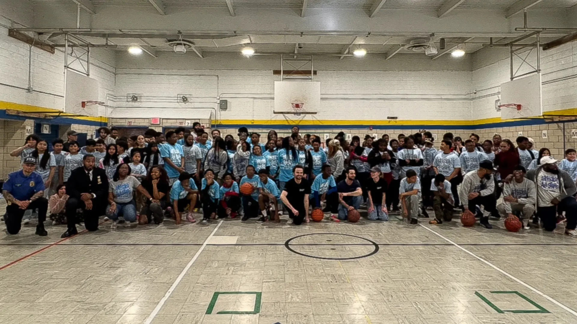 A group of people on a basketball court