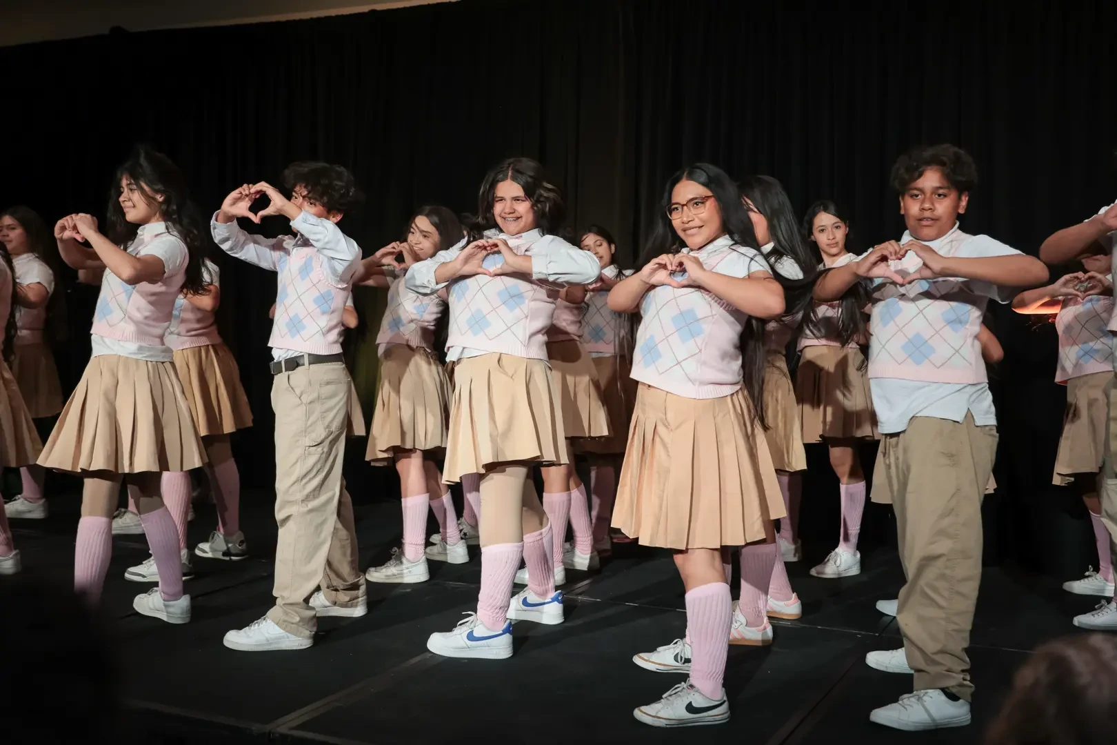 Students on a stage posing