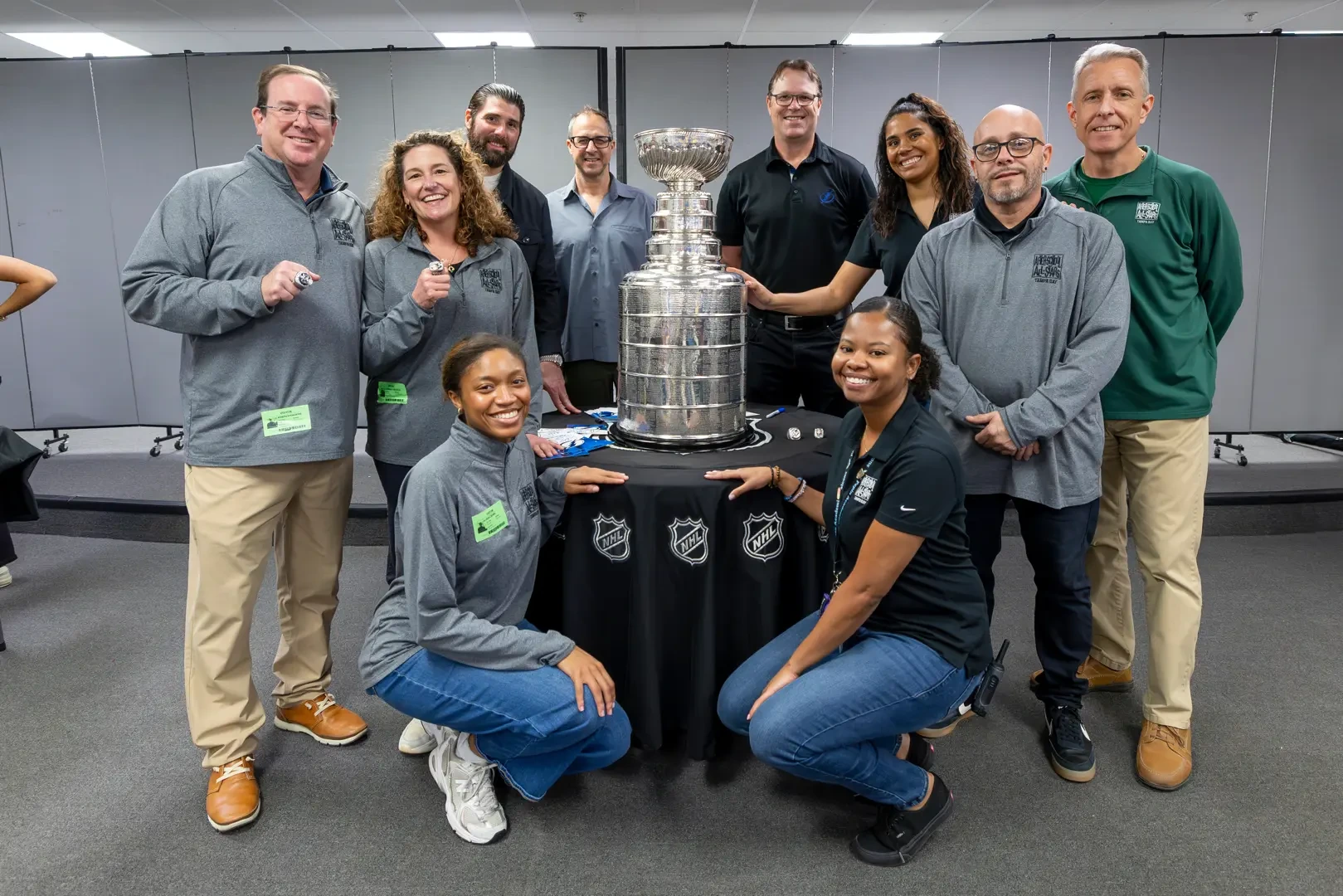 A group of ASAS teammembers posing with the Stanley Cup