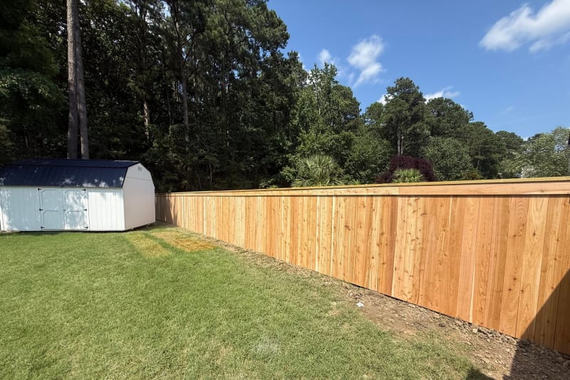 Cedar capped top privacy fence with brick columns in Chesapeake VA by Kempsville Fence — photo 3