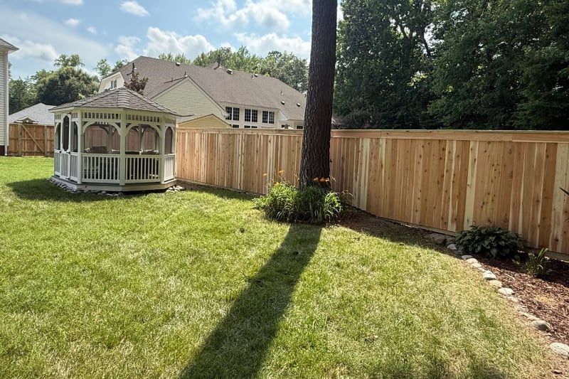 Cedar capped top privacy fence with brick columns in Chesapeake VA by Kempsville Fence — photo 7