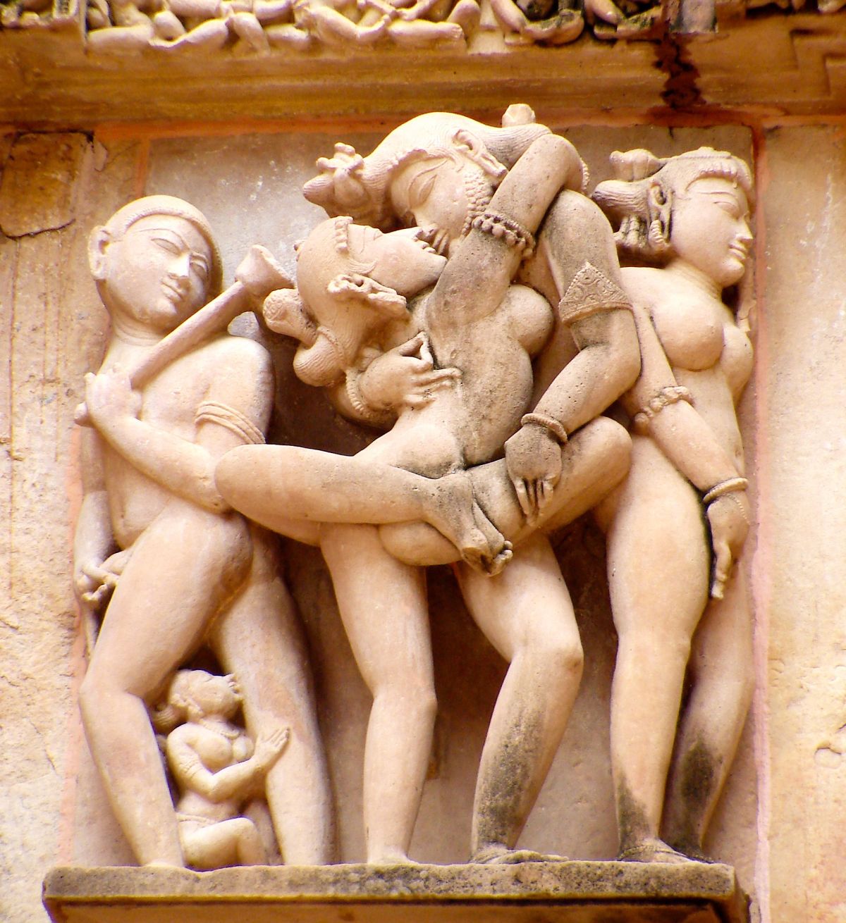 Khajuraho: Couple in loving sexual embrace, temple in India, sex, stone, sculpture, tantra, kama sutra, tantra