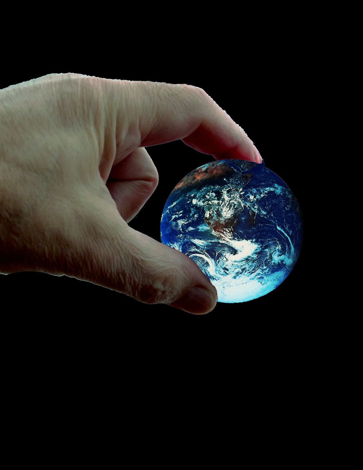 Hand holding planet earth