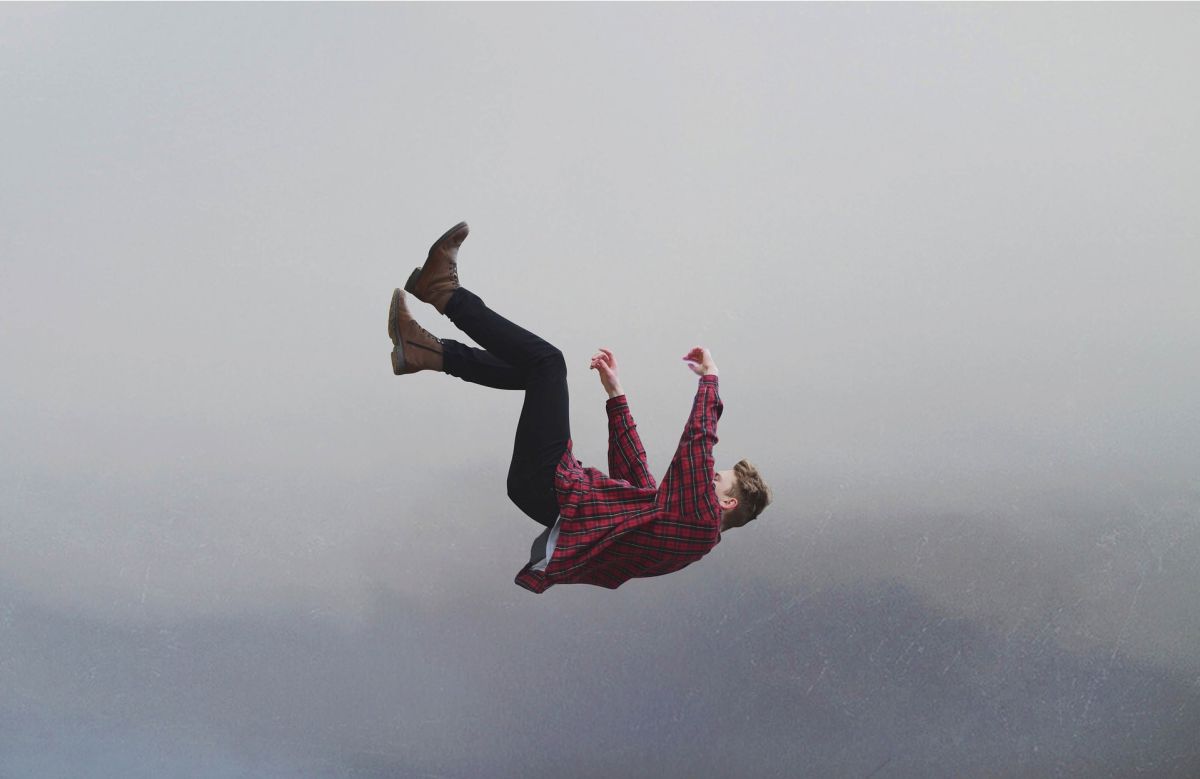 Man falling through sky