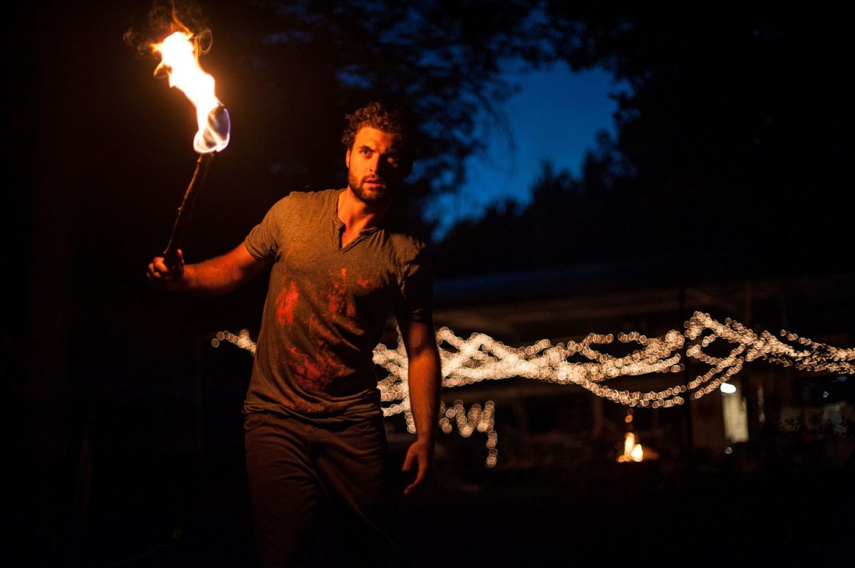 Man, guy, holding torch in dark, black night