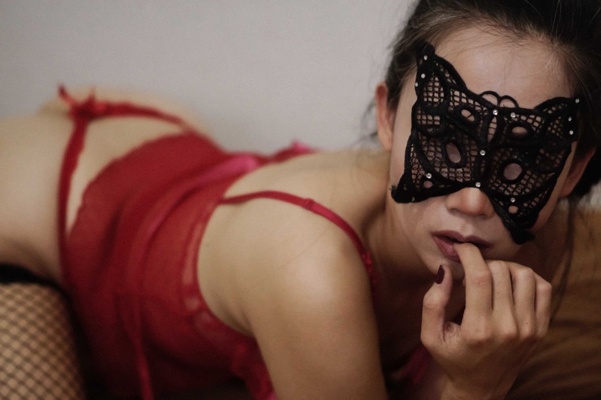 Woman with sexy mask and red lingerie