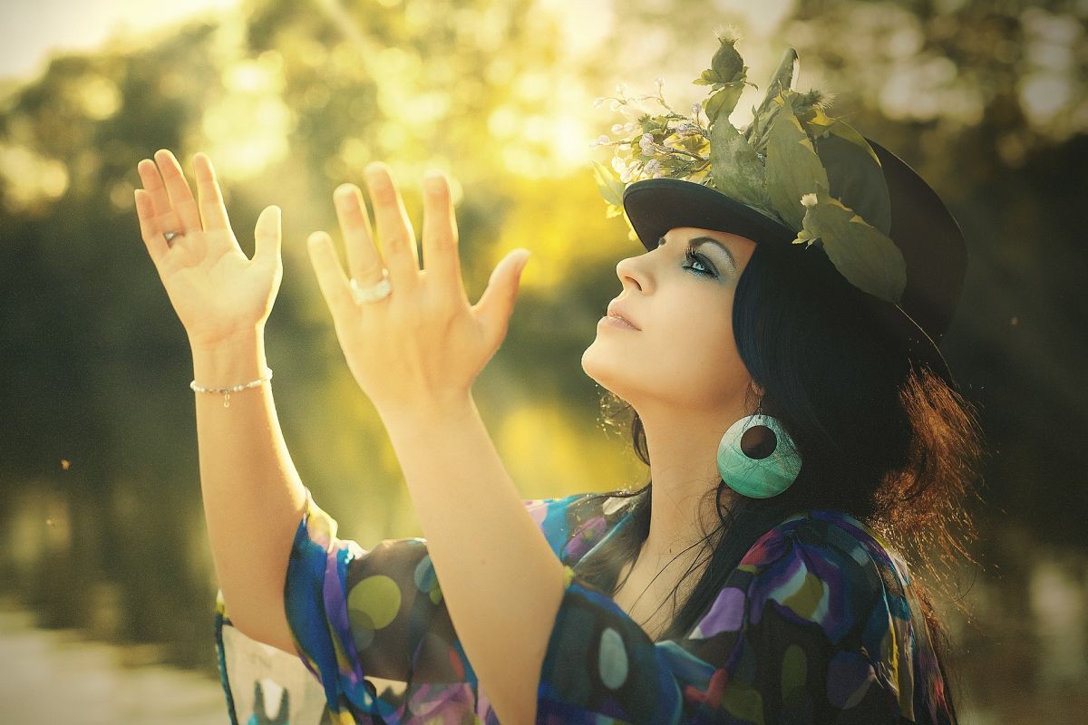 Beauty, woman, holding hands up, flowered hat