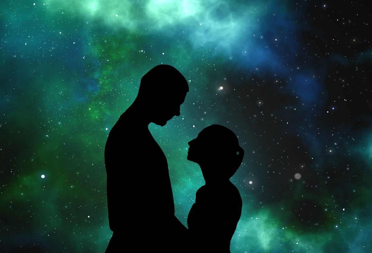 Couple silhouette: Lovers in front of universe