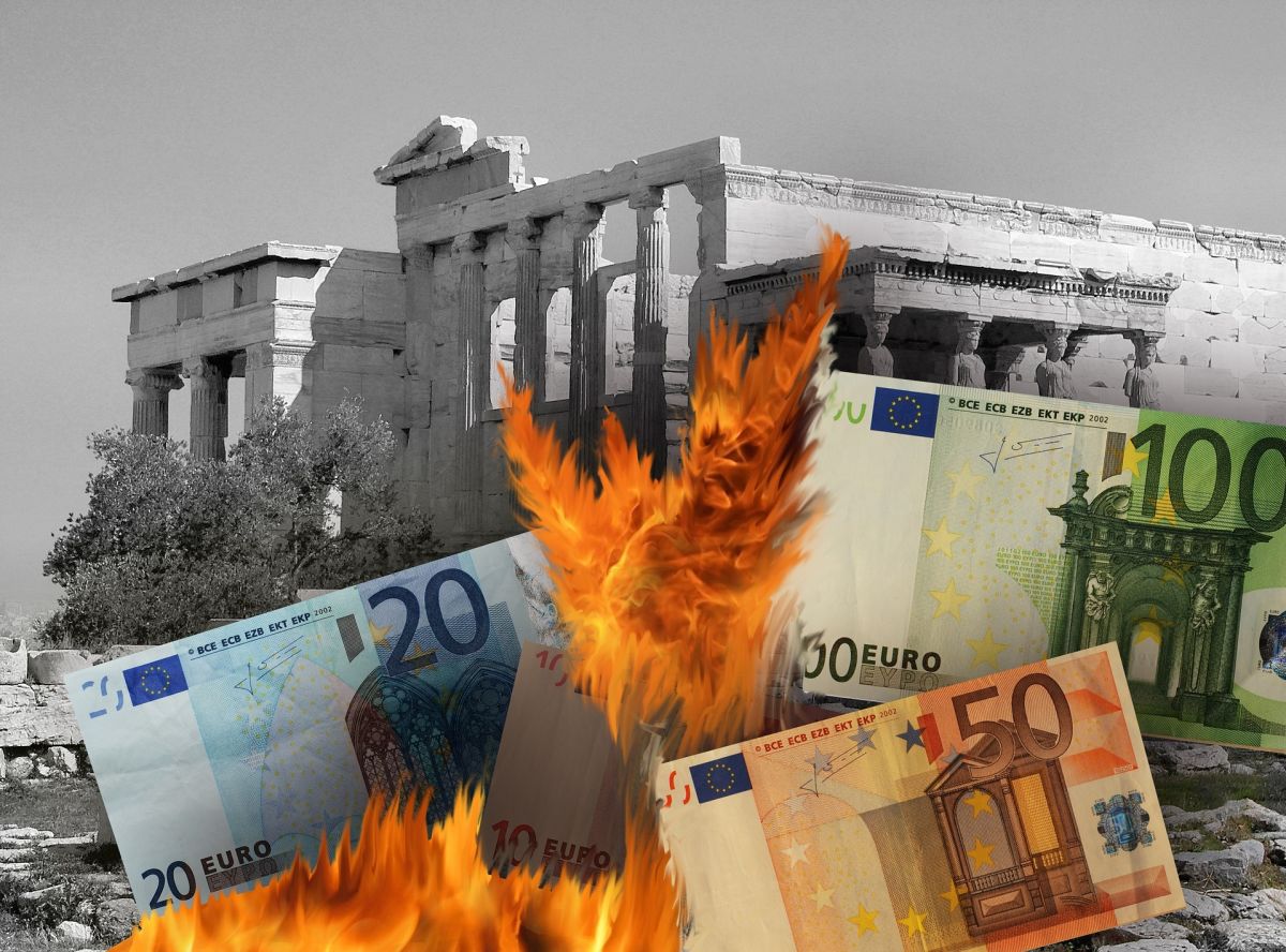 Burning euro notes with ruins