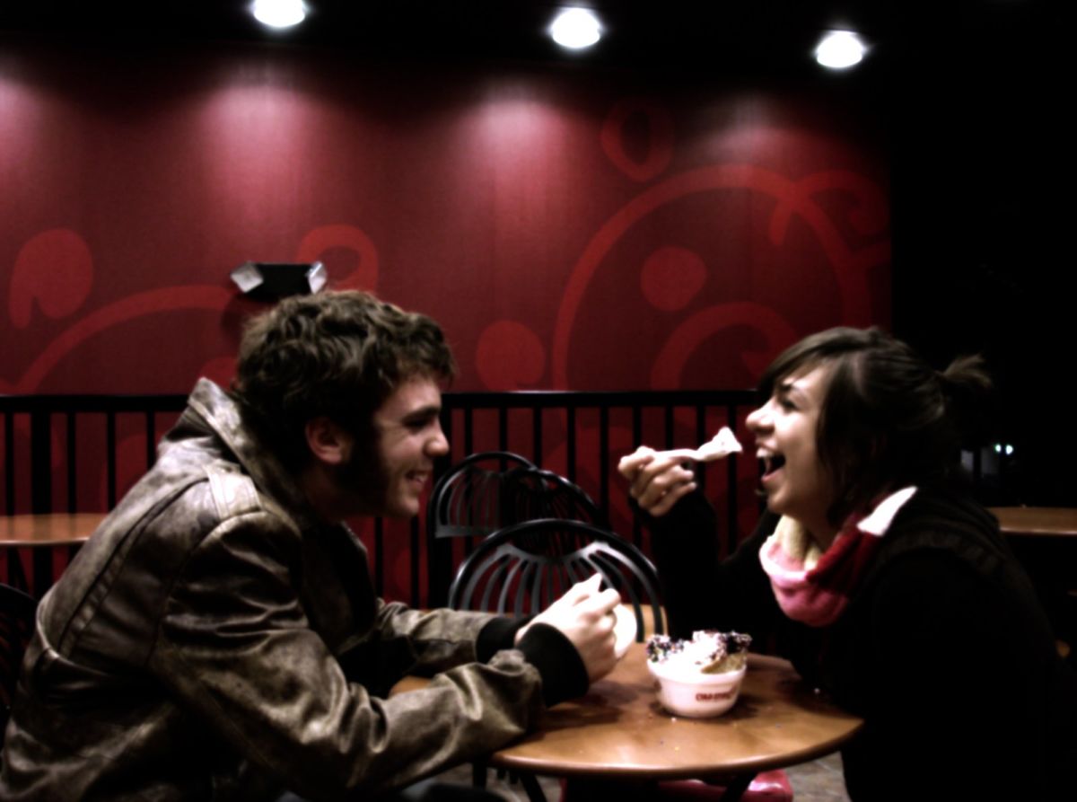 Dating: couple feeding each other