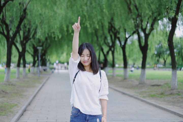 Woman pointing above