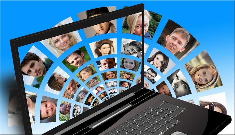 Social Media on laptop with men and women