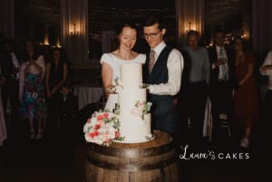 Wedding cake: A bride and groom cutting their wedding cake