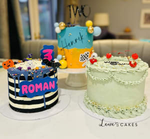 Celebration cake: A couple of cakes sitting on top of a table