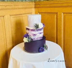 Wedding cake: A purple and white cake on a table