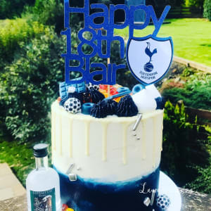 Celebration cake: A birthday cake with a blue and white theme