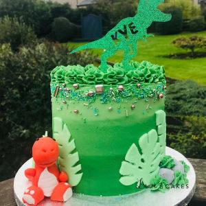 Celebration cake: A dinosaur on top of it