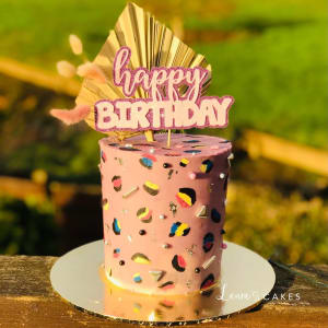 Celebration cake: A birthday cake with a book on top