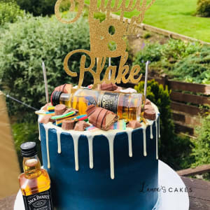 Celebration cake: A bottle of whiskey and a bottle of liquor