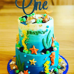 Celebration cake: A blue and green cake topper